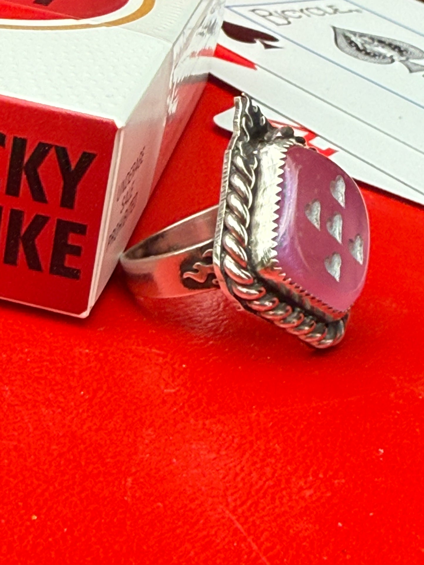 Pink flame dice ring